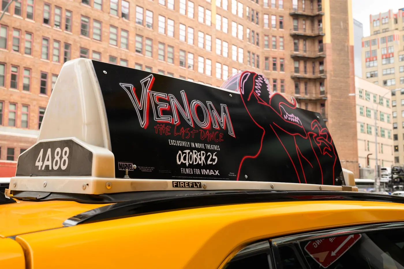 A static taxi top promoting a film's opening date