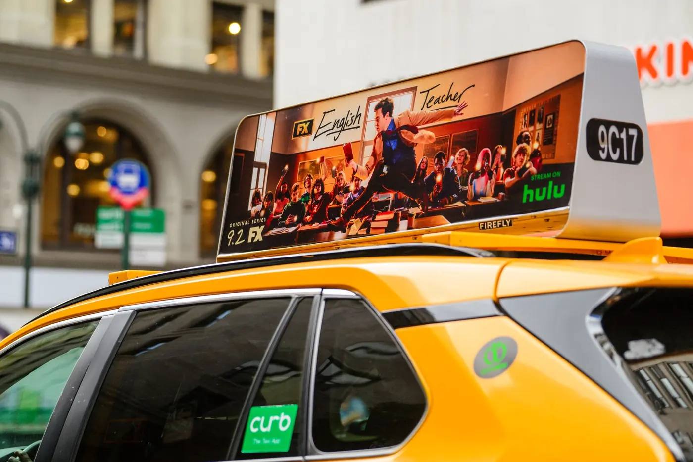 Close-up of a static taxi top carrying a TV series campaign
