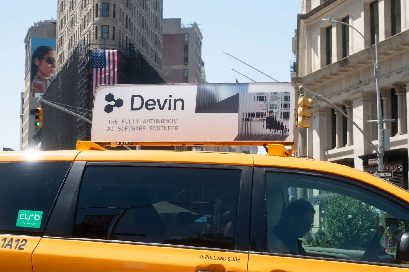 A static taxi top for an AI software company passing the Flatiron district